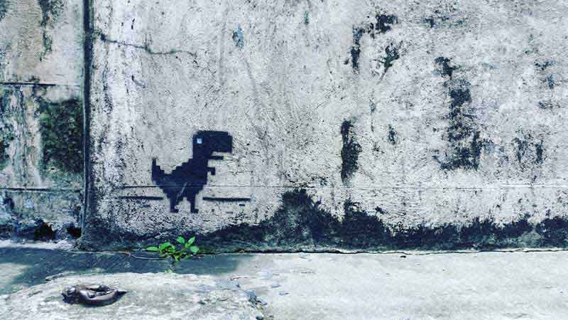 تصویر نقاشی دایناسور روی دیوار