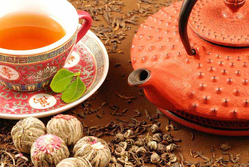 عکس زیبا از دمنوش و قوری نارنجی